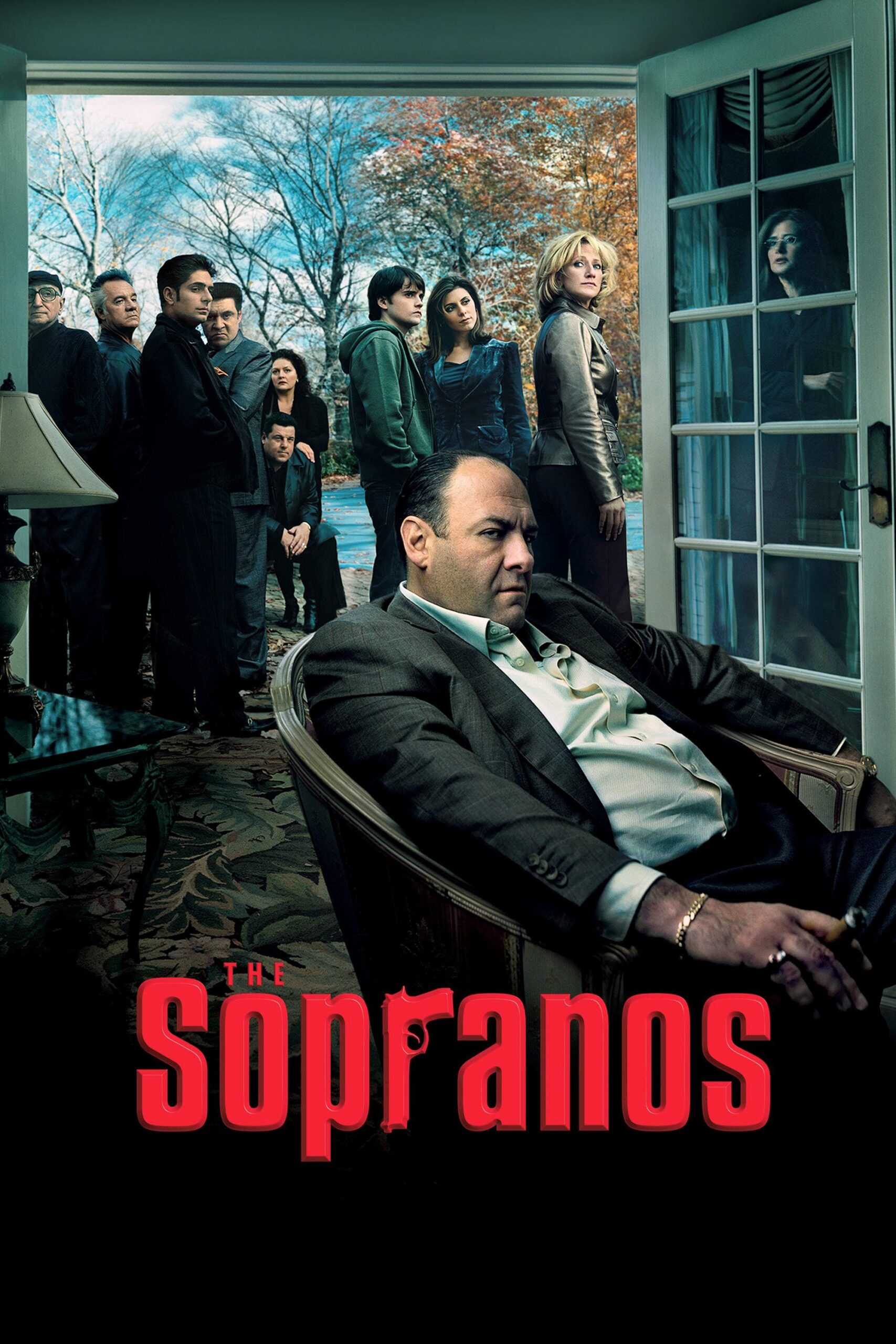 A man sits in an armchair indoors, looking serious, while a group of people stand outside near open glass doors. The title The Sopranos is at the bottom in bold red letters—highlighting a show you won’t want to miss when you purchase IPTV.