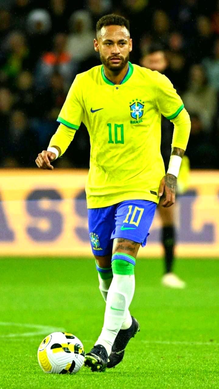A soccer player in a yellow Brazil jersey with the number 10 controls the ball on a field during a match, capturing the excitement you can experience when you purchase IPTV and stream games live from anywhere.